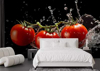 fresh tomato falling in water splash on black background. Wall mural