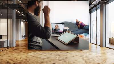 Funny picture of two men videoconferencing at the same room Wall mural