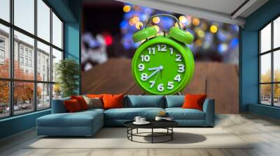 green clock on table Wall mural