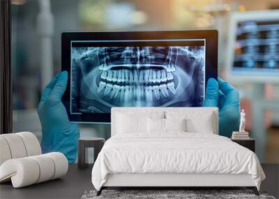 Hands doctor dentist in gloves show the teeth on x-ray on digital screen in dental clinic on light background with medical equipment. Smile healthy teeth concept, close up Wall mural