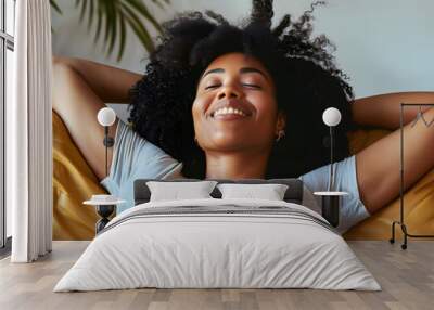 Happy afro american woman relaxing on the sofa at home - Smiling girl enjoying day off lying on the couch - Healthy life style, good vibes people and new home concept Wall mural