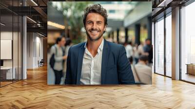 happy business man standing in office Wall mural