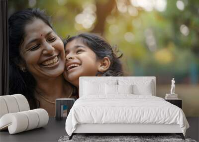 Happy indian mother having fun with her daughter outdoor - Family people and love concept - Focus on mum face Wall mural