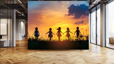 international children day background, kids silhouette in sunset and blue sky Wall mural