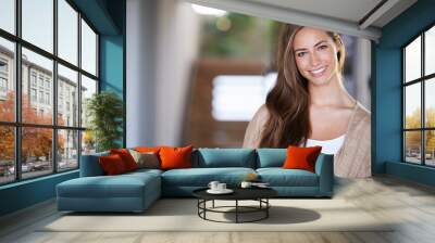 Home makes me happy. Shot of an attractive young woman relaxing at home. Wall mural