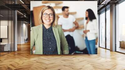 Confidence is key in business, know your strengths. Shot of young businesspeople in the office. Wall mural