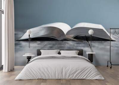 open Holy Bible on table Wall mural