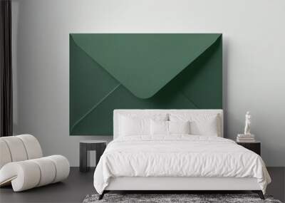 Overhead photo of green envelope isolated on the grey background Wall mural