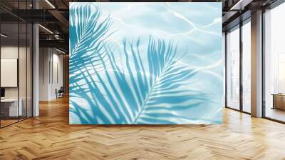 Palm leaf shadow on blue water waves Wall mural