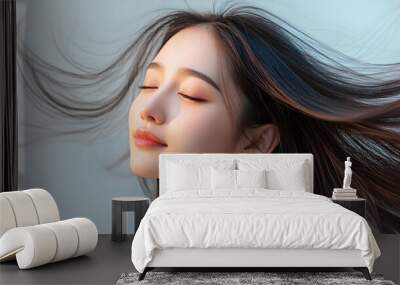 Portrait of a beautiful young asian model woman shaking her beautiful hair in motion. Women's hair is vibrant and shining. Wall mural