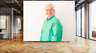 portrait of one old and mature man looking at the camera smiling and laughing - happy senior with white background Wall mural