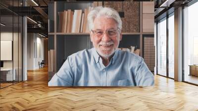 Portrait of one old cheerful male senior smiling having fun at home. Mature caucasian man studying independent looking at the camera and posing to picture.. Wall mural