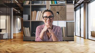 Portrait of one young and happy cheerful woman smiling looking at the camera having fun. Headshot of female person working at home in the office. Wall mural