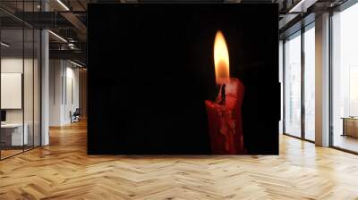 red candle in the dark Wall mural