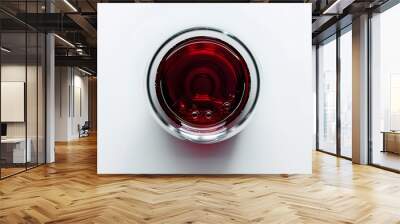 Red wine in glass isolated on white background viewed from above Wall mural