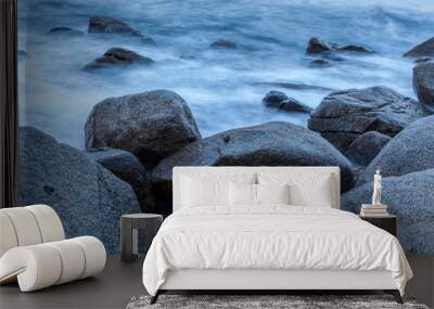 Rocks and surf, waves hitting the shores and beach coastline Wall mural