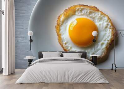 Single fried egg on white plate, minimalist composition. Wall mural