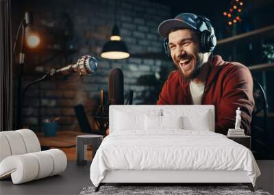 smiling young man with headphones talking on microphone at home Wall mural