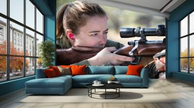 Close-up of a woman shooting a rifle Wall mural