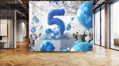 The massive open white box with huge inflatable blue numbers 5 flying out of it along with blue balloons and a crowd of office workers on a blurred background Wall mural