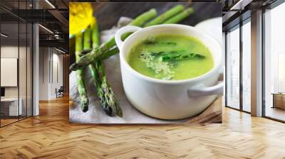 Creamy asparagus soup on wooden background Wall mural