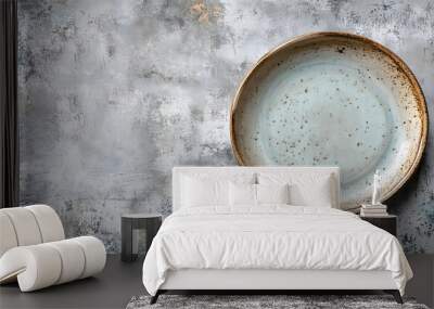 Vintage style top view of empty ceramic plate on concrete with copy space Wall mural