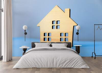 wooden house model on blue background Wall mural