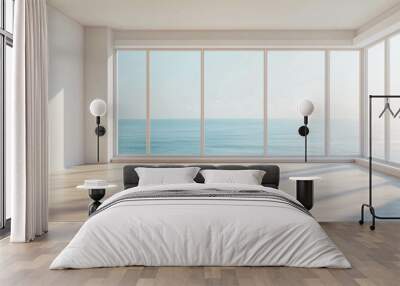 An empty living room with a bright and large window with a light blue ocean view Wall mural