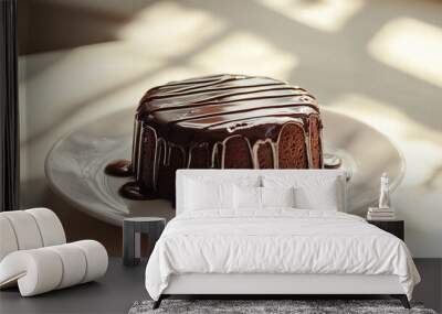 Chocolate cake on a white plate with a light beige background Wall mural