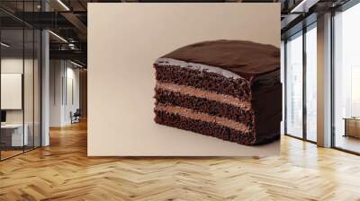 Chocolate slice on a light beige background Wall mural