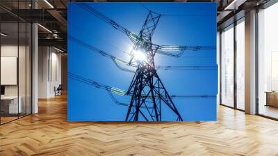 Low angle of power lines against blue sky and sun, Johannesburg, South Africa Wall mural