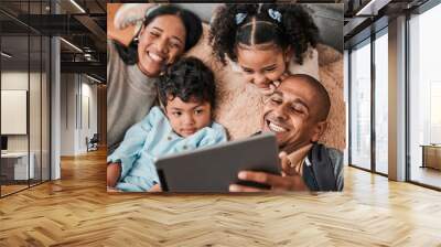 Family, children and parents on tablet for movie, film or cartoon streaming on internet subscription and living room floor. Home, selfie and happy mom, dad and kids watch on digital technology Wall mural