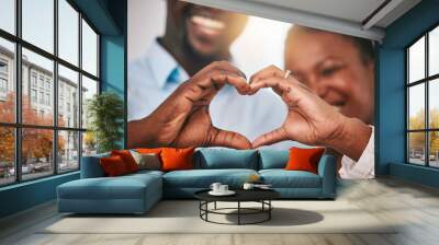 Hands in heart, love and couple with sign by home with gesture for love, support and care. Emoji, happy and closeup of black man and woman with shape for bonding, commitment and healthy marriage Wall mural