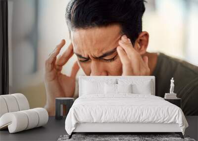 Man, headache and pain in home from stress, mental health fatigue and mind problem. Face, sick and depression of frustrated male person in anxiety, brain fog and dizzy from failure, worry and vertigo Wall mural