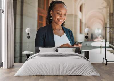 Phone, travel and a business black woman in the city, searching for directions or typing a message. Mobile, commute and map with a young female employee looking for a location on a navigation app Wall mural