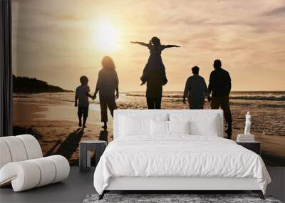 Silhouette, family is walking on beach and back view with ocean waves, sunset and bonding in nature. Generations, people outdoor and tropical holiday, freedom and travel with trust and love in Mexico Wall mural