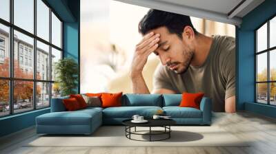 Tired, headache and stress of man in living room with mental health, fatigue and sad problem. Face, depression and frustrated male person with anxiety, brain fog or crisis of failure, mistake or debt Wall mural