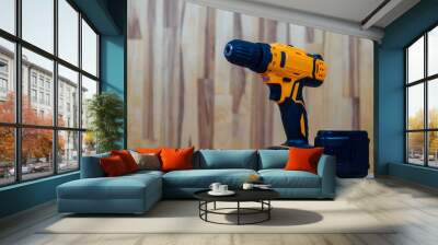 A screwdriver-drill against a wood background, ready for work, is ideal for repairs and construction in the country or at home Wall mural