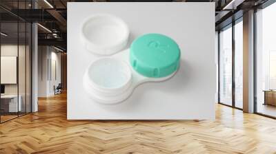 container for soft contact lenses and lens on light background Wall mural