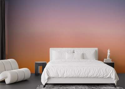 Predawn clear sky with orange horizon and violet atmosphere. Smooth orange violet gradient of dawn sky. Background of day beginning. Heaven at early morning with copy space. Sunset, sunrise backdrop Wall mural