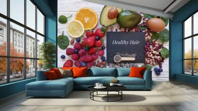 Foods for healthy long hair. Best beauty foods for shiny, strong hair. Concept of hair growth food. Fresh berries, citrus fruit, almond, avocado, spinach, beans, sunflower and chia seeds. Wall mural