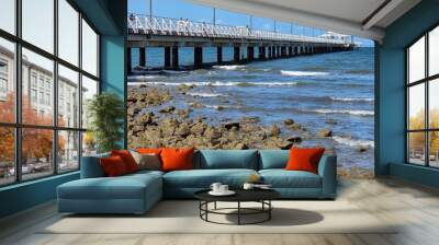 pier on the beach, rocks Wall mural