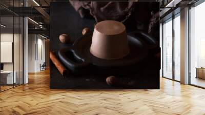 Chocolate Panna cotta is an Italian dessert of sweetened cream thickened with gelatin and molded. Wall mural