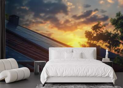 Closeup of photovoltaic panels on the roof, a house in the background with garden and sunflowers at sunset Wall mural