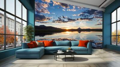 Sunset clouds reflect into wetlands along the Rocky Mountain Front with Haystack Butte near Augusta, Montana, USA Wall mural