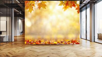 Vibrant autumn leaves in vivid reds oranges and yellows with soft bokeh background Wall mural