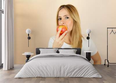 Woman eating an apple Wall mural