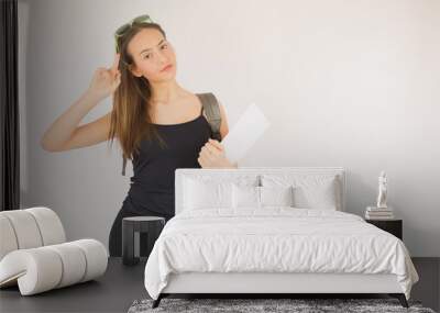 Young beautiful schoolgirl with glasses and bag Wall mural