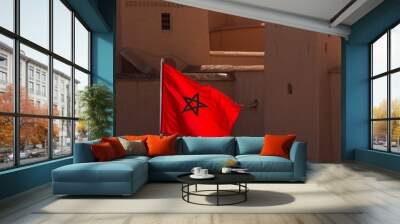 Waving Fabric Flag of Morocco with traditional building in backg Wall mural