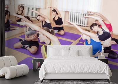 Sport and Healthy Life Concepts. Group of Seven Young Caucasian Ladies Training Wall mural